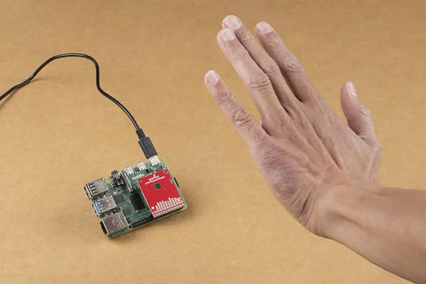 60GHz Pulsed Radar Breakout A111 With Integrated Antenna Single Chip PCR Radar Solution SPI Interface Up To 50MHz High Precision Distance Motion And Gesture Sensing For DIY Projects board beside hand