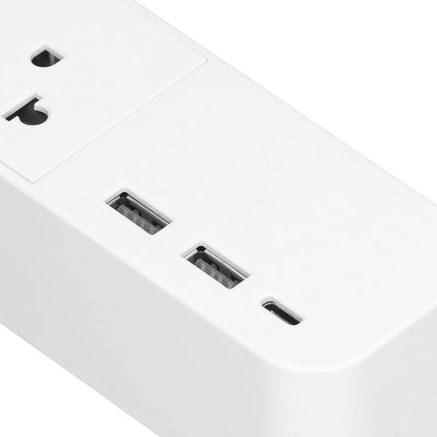 Close-up of Kickass Smart Power Strip featuring four AC outlets and USB ports, designed for home office use.