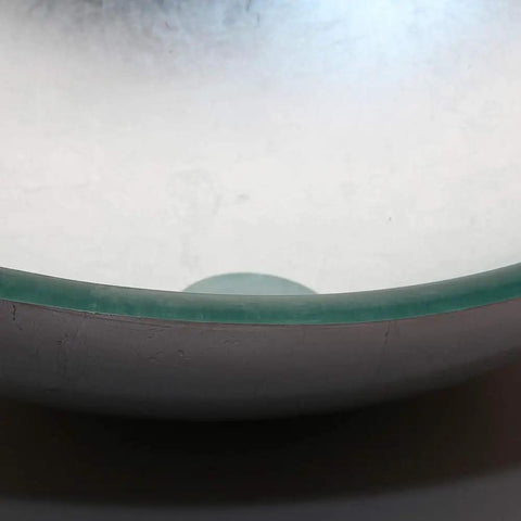 Close-up of the smooth glass basin from Artistic Tempered Glass Oval Vessel Sink Above Counter with Chrome Faucet and Pop Up Drain