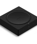 Black versatile home audio amplifier for any setup from your turntable to outdoor speakers powers vinyl CDs stored audio files and streaming and even expands your backyard entertainment.