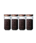 Top Shelf Airtight Glass Storage Jars With Smooth Acacia Wood Lids Keeps Your Daily Drip Locked Up Tight For Coffee Beans Tea And Dry Goods In This Bpa Free Four Pack Kitchen Essential, filled with coffee beans.