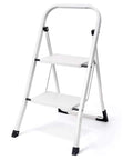 Two Step Folding Ladder With Handgrip And Wide Anti Slip Pedals Heavy Duty Safe Lightweight Step Stool For Kitchen Or Closet Portable And Durable Two Feet Tall with white frame and black feet