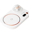 Portable Digital Cup Warmer With Three Heat Settings Hits The Spot Every Time Keeps Your Daily Brew Steaming Hot Sleek Coaster For Office Desk Dorm Rooms showing a white sleek coaster with a small cat figurine.