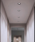 saditesdk 12Pack Led Recessed Lighting - 5W/7W Black Recessed Lights in a modern hallway ceiling.