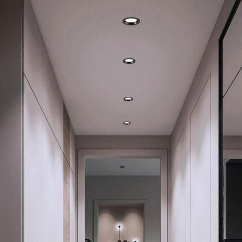 saditesdk 12Pack Led Recessed Lighting - 5W/7W Black Recessed Lights in a modern hallway ceiling.