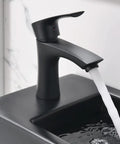 Close-up of matte black faucet flowing into basin, part of 18 Inch Corner Bathroom Sink With Matte Black Faucet Ultra Space Saver Wall Mount Vessel Sink For Tight Nooks Narrow Bathroom Vanity Or Cloakroom Porcelain Ceramic Basin With Overflow Left Hand