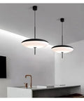 Modern Pendant Light LED Minimalist Black and White Pendant Light Restaurant Study Living Room Bedroom Home Light,Luxury(Tricolor Light,White 30cm) hanging above a kitchen island.