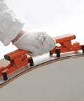 Flexible Sanding Block Flexisander for Curved Surfaces in use on a round wooden structure, showing sturdy fastening system
