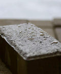 Concrete brick block with wet look finish showcasing Heavy Duty Wet Look Paver Sealer For Concrete And Brick Blocks Rain UV Damage.