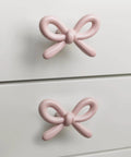 Snag These Premium Vintage Pink Bow Cabinet Knobs 6 Pack Farmhouse Traditional Solid Metal Drawer Pulls on white drawers.