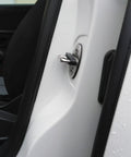 Close-up of a door latch on a Volkswagen with the Premium Door Lock Sound Deadener Soundproof Buffer Pads installed.