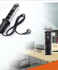 Slick Retractable Table Socket With Dual USB Ports And Six Standard Outlets Smooth Glide Design For Office Desks And Kitchen Countertops in black and silver.