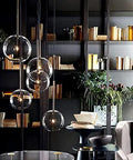 Modern Six Head Glass Pendant Ceiling Light With Warm White Bubble Shades And Brushed Chrome Frame in stylish interior setting.
