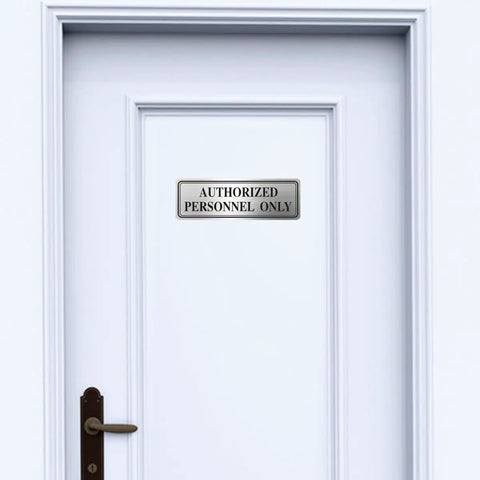 Genuine Stainless Steel Authorized Personnel Only Sign 3 By 9 Inches on a white door background.