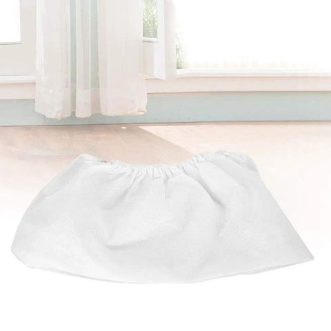 Heavy Duty Non Woven Dust Collector Bag For Nail Suction Machine With Secure Snap And Easy Change Design, white, flat on floor.