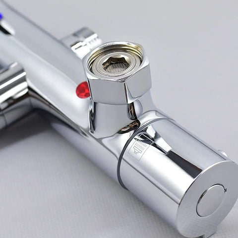 Close-up of Heavy Duty Solid Brass Thermostatic Mixing Valve for Concealed Wall Piping with chrome finish and connection detail.