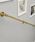 White Staircase Handrail And Safety Banister For Indoor Outdoor Steps Wall Mount Accessory Rail With Rust Proof Finish No Fuss Hardware Kit For Seniors Kids Firm Grip 17 Feet Long mounted on wall with framed art.