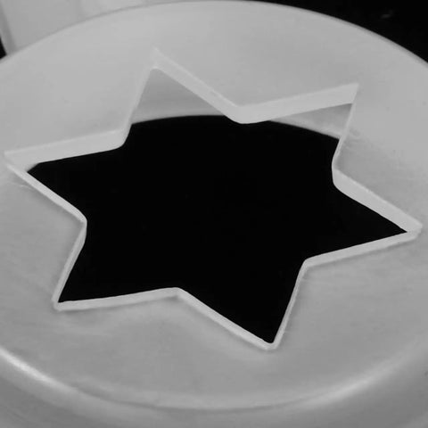Close-up of Six Point Star Ice Cream Nozzle Replacement for Soft Serve Machines Hexagon Shaping Tip in white.