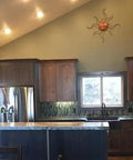 Modern kitchen with mahogany cabinets and green accents showcasing Top Shelf Mahogany Interior Wood Stain Featuring A Tannin Reactive Water Based Formula With Zero VOCs.