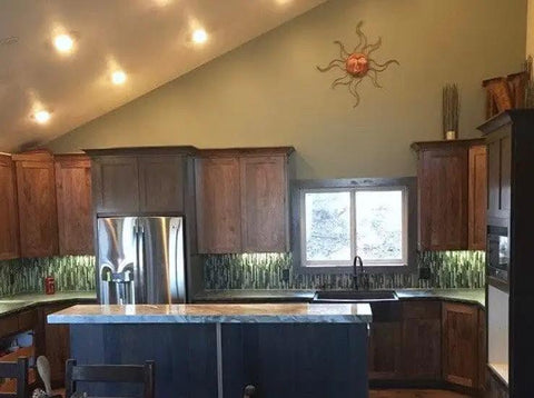 Modern kitchen with mahogany cabinets and green accents showcasing Top Shelf Mahogany Interior Wood Stain Featuring A Tannin Reactive Water Based Formula With Zero VOCs.