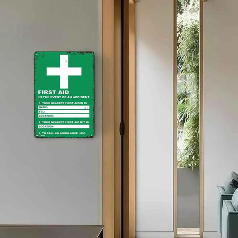 Durable Aluminum First Aid Location Sign 12 By 8 Inches With Ultra Readable Crisp Printing on a hallway wall.