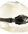 ProTac HL Headlamp With 635 Lumen Output And 8500 Candela mounted on a white hard hat, durable design for work sites
