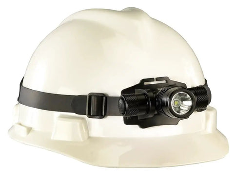 ProTac HL Headlamp With 635 Lumen Output And 8500 Candela mounted on a white hard hat, durable design for work sites