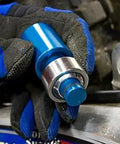 Shop Grade Blue Ktm Heim Joint Tool With Comfort Grip For Heavy Dirt Bike Suspension Work And Quad Repairs Features Locking O Ring Mechanism For Fast Seal Alignment And Solid Bearing Installations held in a gloved hand.