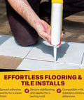 Dripless CR400 contractor caulk gun applying white sealant to tiled floor; yellow-cap cartridge.