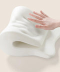 Hand pressing Comfort Enhancing Desk Headrest Pillow For Office Use Ergonomic Memory Foam Chair Neck Support showing foam flexibility