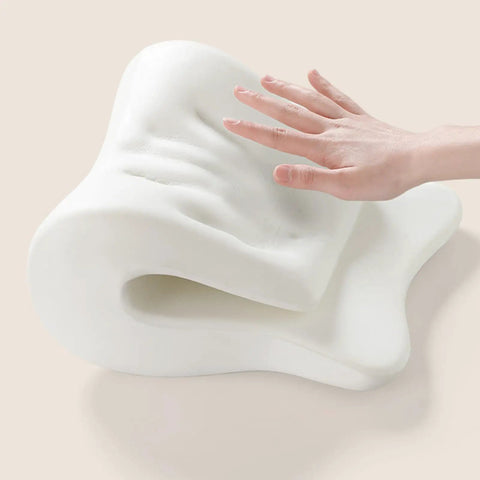 Hand pressing Comfort Enhancing Desk Headrest Pillow For Office Use Ergonomic Memory Foam Chair Neck Support showing foam flexibility