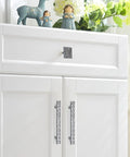White cabinet with Crystal Glass Rhinestone Cabinet Pulls 4 Pack Shiny Dresser Knobs Handles for cupboard doors.