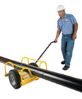 Cricket pipe dolly side view with yellow frame and large wheels moving a long black pipe.