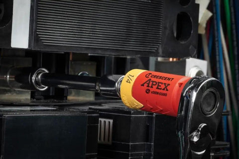 Eshok Guard One Quarter Inch Socket Isolator with Square Drive Female to Male Two and One Eighth Inch Overall Length Non Sparking for One Quarter Inch Drive Tools and Socket Sets positioned in industrial setting.