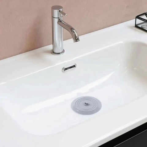 TKOWTB Bathtub Drain Stopper Silicone Drain Plug with Strong Suction Seal in a clean white bathtub.