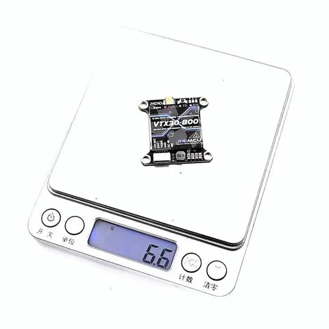 40CH FPV Video Transmitter VTX30-800 With PitMode on digital scale showing 6.6 grams
