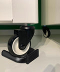 2 Pack No Slip Wheel Stoppers For Caster Wheels, Heavy Duty Rubber Cups, Bed And Fridges Stop Pads, Protect Hardwood Floors, Great For Office Chairs, Cribs, And More, Black installed under office cabinet caster wheels