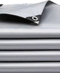 Heavy Duty Tough As Nails Waterproof Tarp 10x12 Ft folded stack showing reinforced edges and grommets for outdoor use.