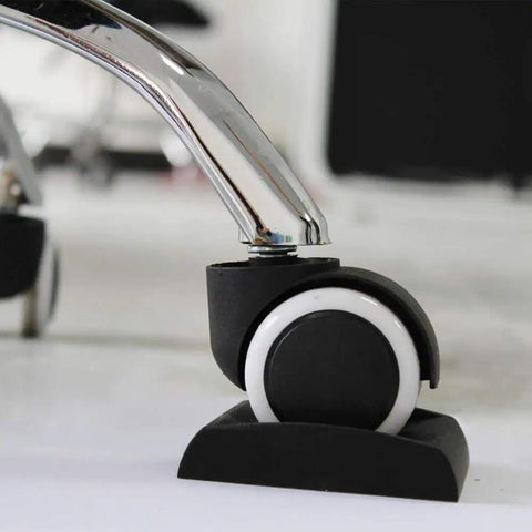 Close-up of a chair wheel in a 3x3 inch heavy-duty silicone caster cup, part of Bed Stoppers And Furniture Cups Set Four Pack 3 Inch By 3 Inch Heavy Duty Premium Silicone Caster Cups To Guard Floors From Scratches Floor Saver For Most Furniture Wheels On Beds Sofas And Chairs.