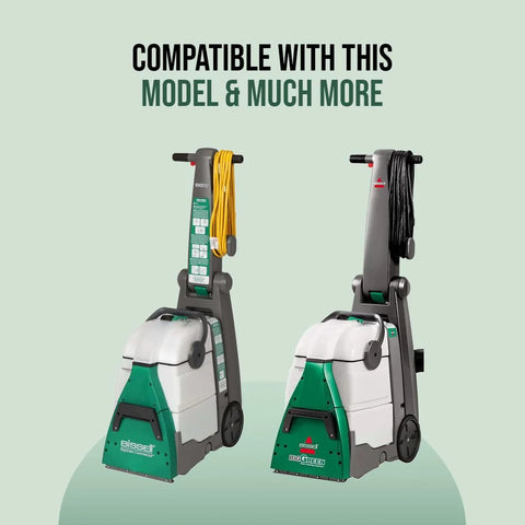 Two Bissell BigGreen commercial carpet cleaners with yellow and black hoses, front view.