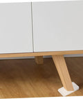 Clear Plastic Leveling Shims For Furniture Wobble Fix 32 Piece Wedge Set under a table leg on hardwood flooring.