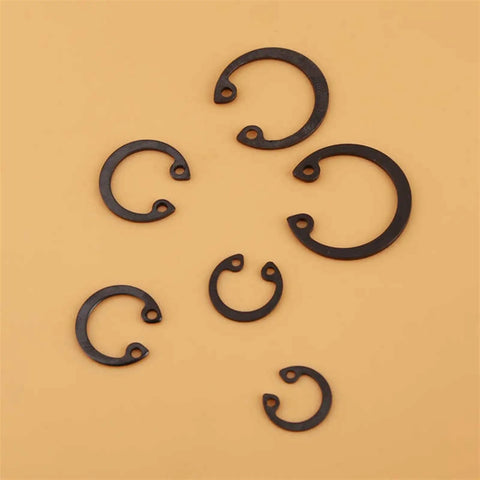Assorted 11mm-21mm steel C type retaining rings from 100 Piece C Clip Snap Ring Kit With Box. Durable steel, corrosion resistant, DIY auto machinery use.