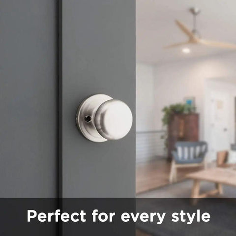 Juno Interior Non-Locking Passage Doorknob For Closets And Hallways, Satin Nickel Finish With Microban Protection shown on a door