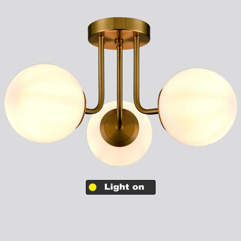 Modern Brass Gold 3 Light Ceiling Fixture With Globe White Glass Shade Semi Flush Mount For Living Room Hallway Sputnik Chandelier Lighting That Delivers Bright Even Illumination And Chic Premium Vibe on gray background