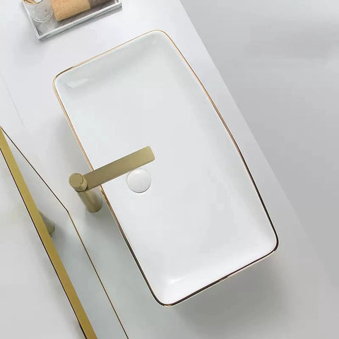 USZWBY Bathroom Vessel Sink Modern Ceramic Vessel Bowl Sink in Decor Golden Top Mount Bathroom Sinks Above Counter Rectangle Vanity Countertop Sink Bowl, WHI from above with elegant design and gold trim.