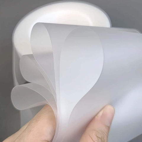 Urethane Die Protection Film For Press Brake Bending 4 Inch Wide 0.012 Inch Thick 100 Foot Roll shown in hand view.