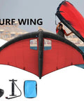 Wind Foil Wing For Surfing And Kitesurfing, Inflatable Handheld Wing With Durable TPU Canopy And Nylon Handle, shown in red near water.
