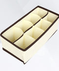 Top Tier Setup For Messy Drawers This Foldable Beige Drawer Organizer boasting eight generous compartments, made of soft non woven fabric.