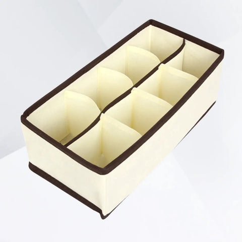 Top Tier Setup For Messy Drawers This Foldable Beige Drawer Organizer boasting eight generous compartments, made of soft non woven fabric.