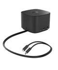 Level Up Your Workspace With This Slick Thunderbolt Dock 230W Delivering 100W Power Delivery To Laptops. Black multiport hub with cables.